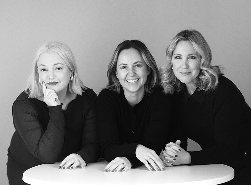 Black and white portrait of three company directors