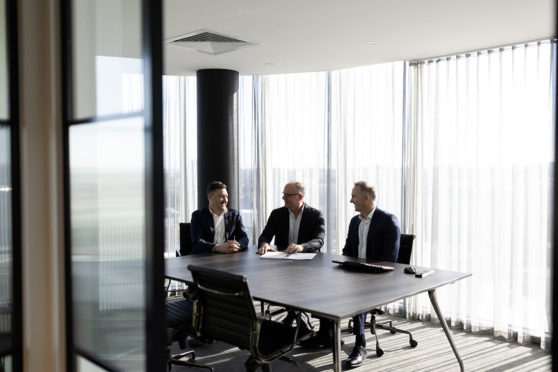 Leadership team meeting in a bright Melbourne workplace