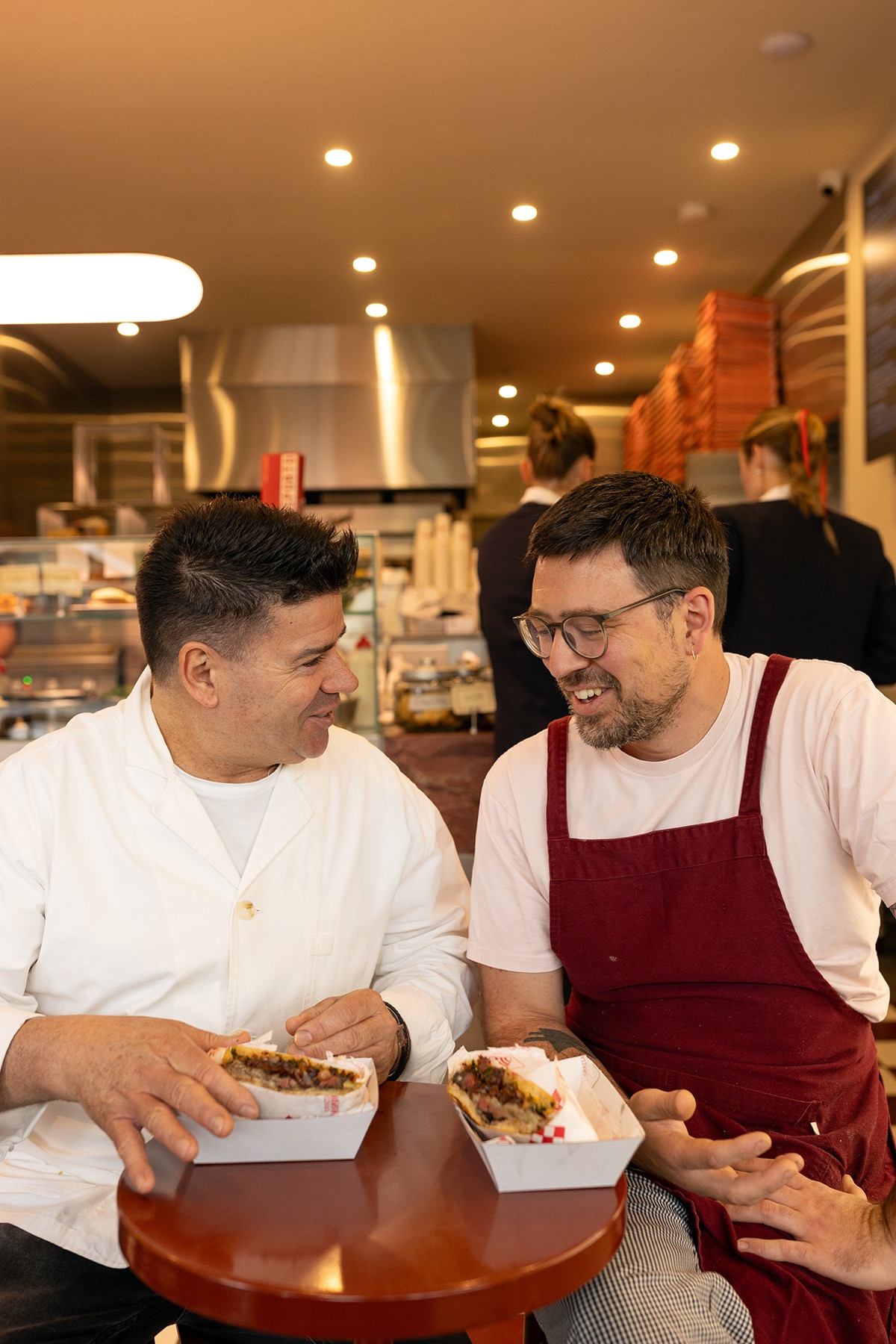 Hospitality team members working together in a restaurant kitchen