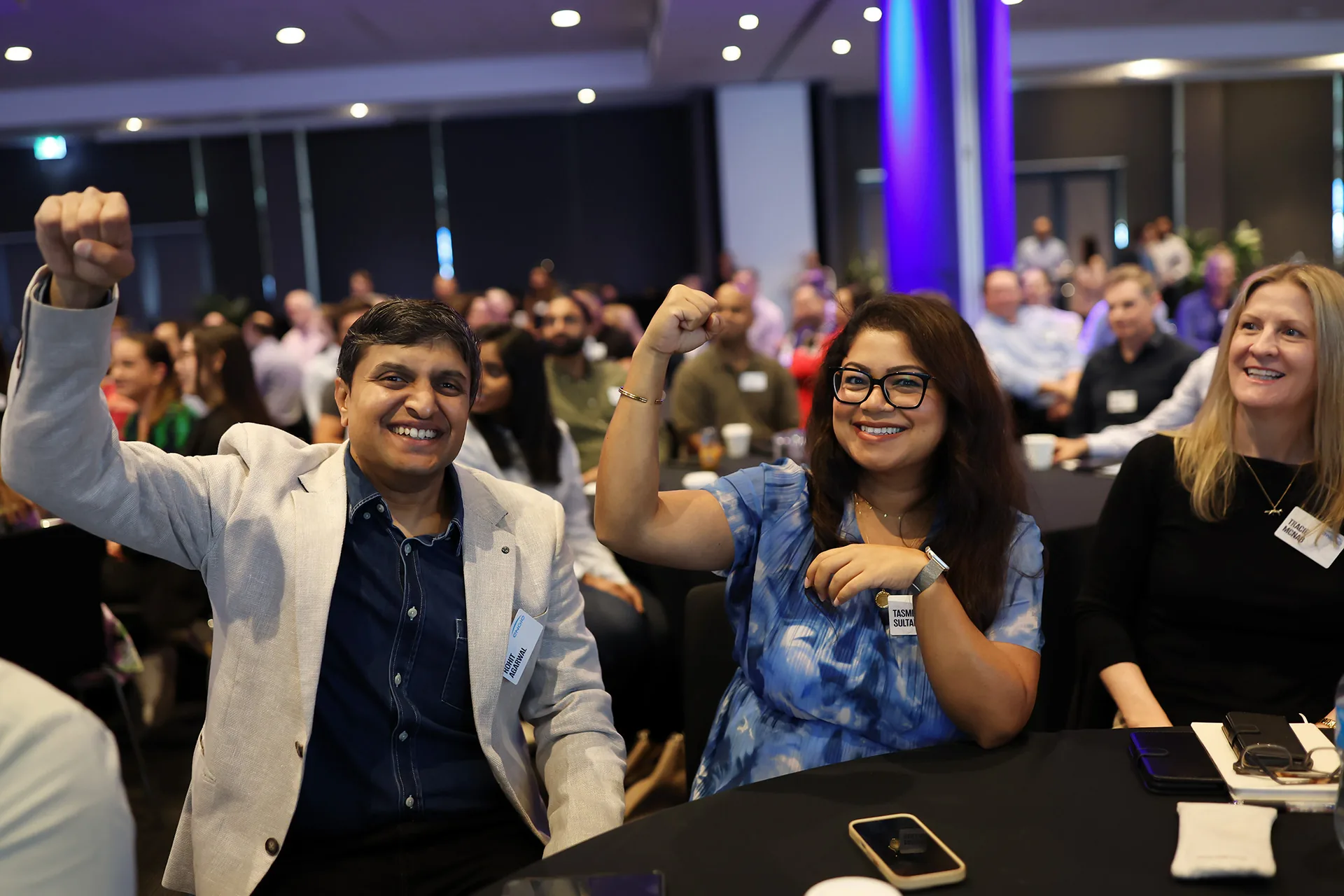 Engaged guests responding during a Melbourne business event