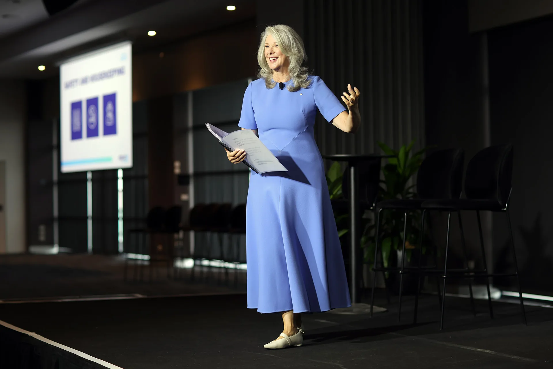 Keynote speaker presenting on stage at a Melbourne business event