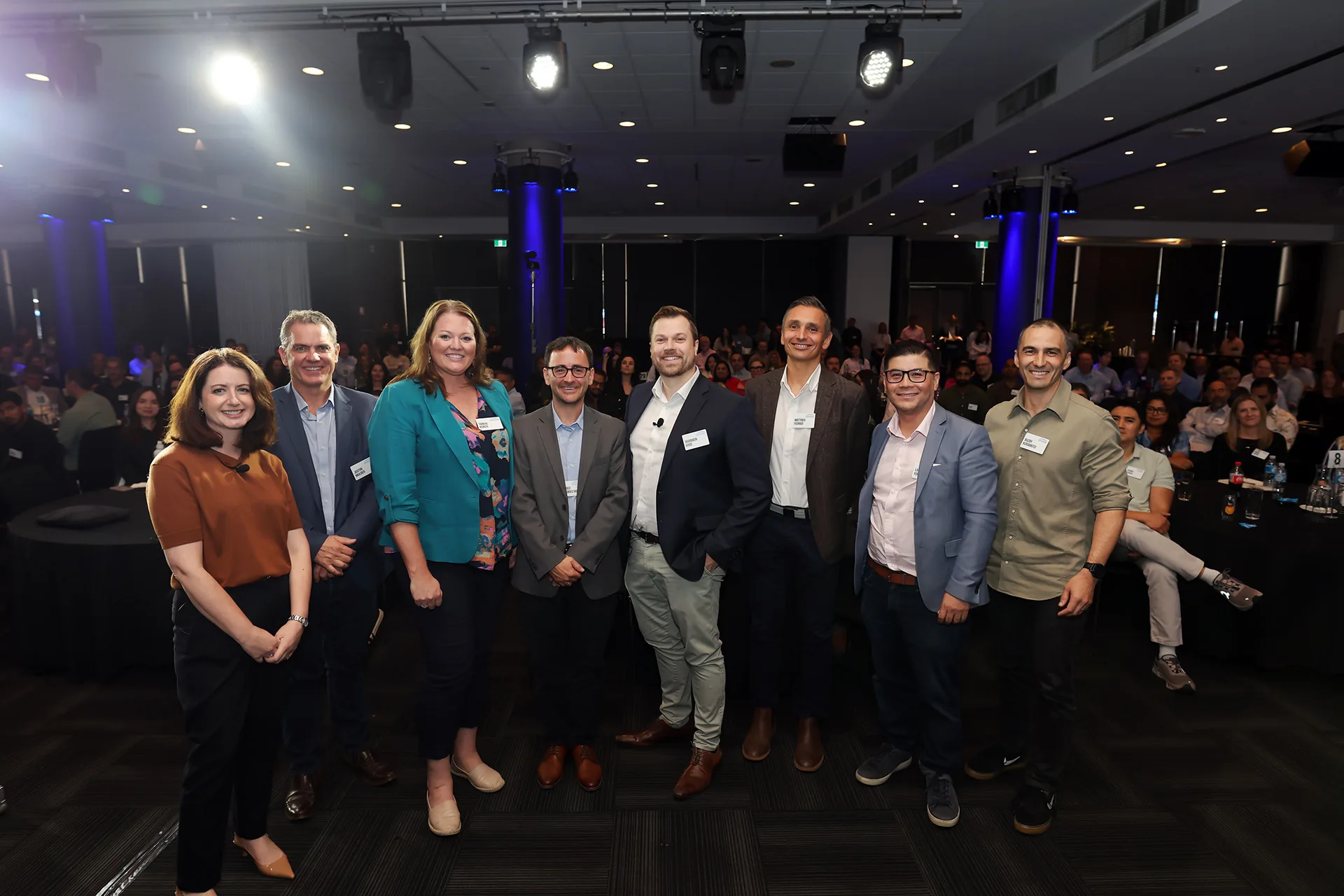 Speakers photographed with the audience at a Melbourne business event