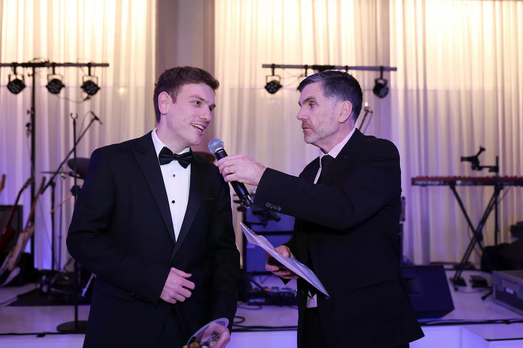 Awards night host interviewing a guest at a Melbourne gala