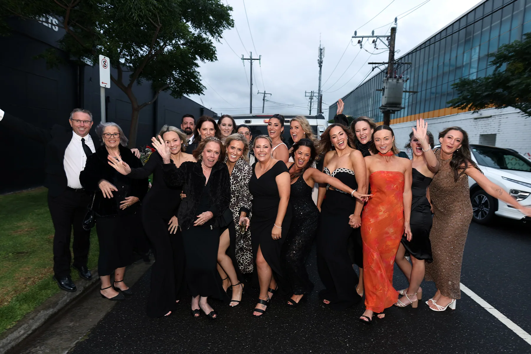 Gala dinner guests celebrating together outside a Melbourne venue