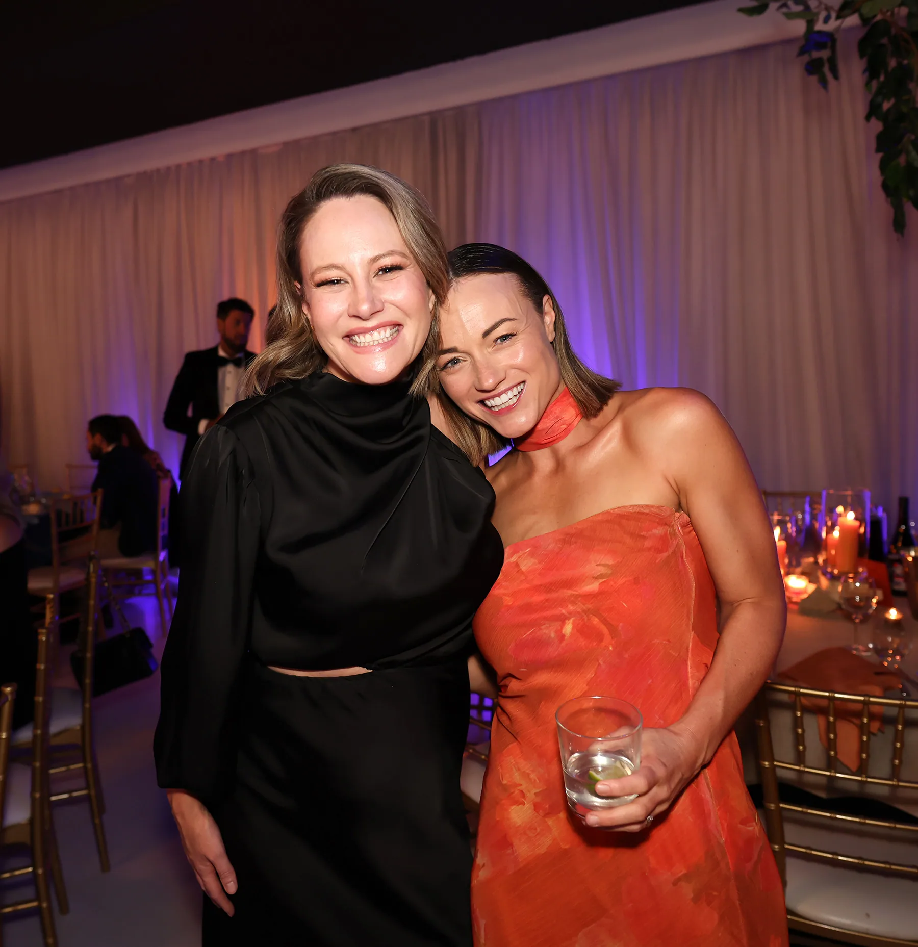 Two gala dinner guests sharing a candid moment at a Melbourne event